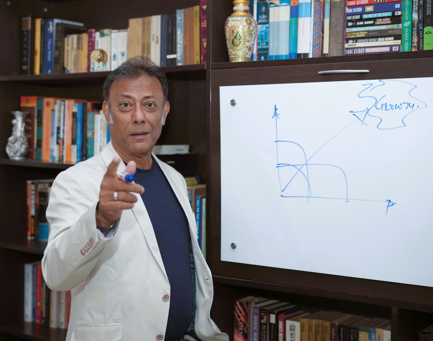 Amit Chatterjee at a whiteboard, mapping a growth curve