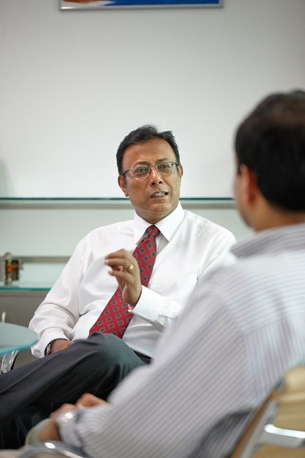 Amit Chatterjee in conversation with a colleague at Sartorius India, 2009
